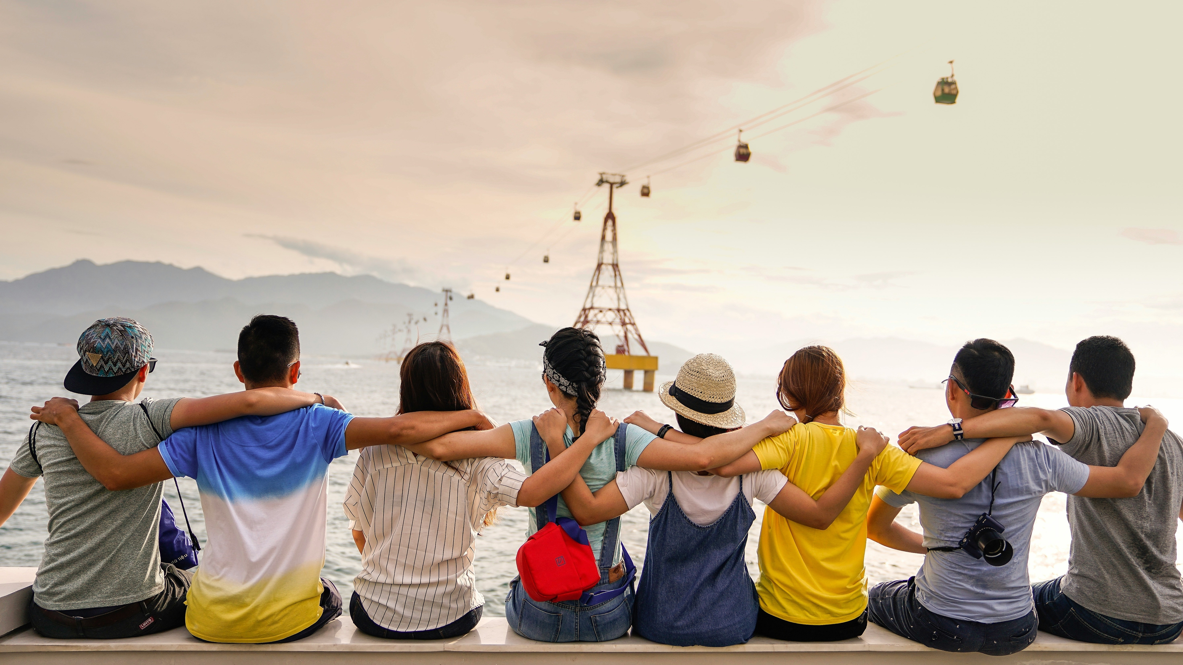 A Team sitting in front of the ocean